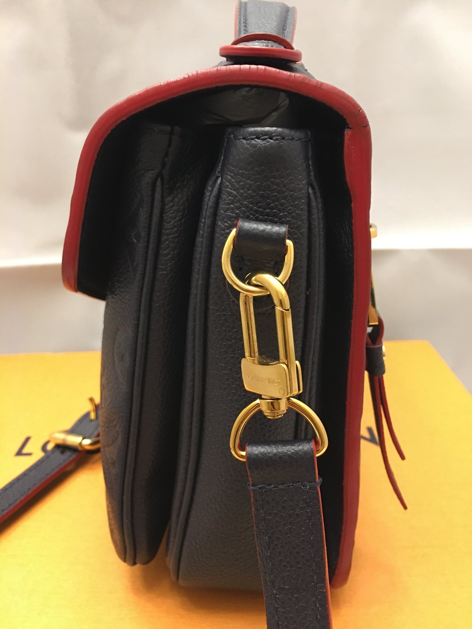 Louis Vuitton Pochette Metis Empreinte Marine Rough Navy Red Leather  Crossbody - Body Logic